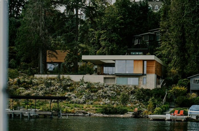 Mid-century modern Windermere home with large windows overlooking Lake Washington