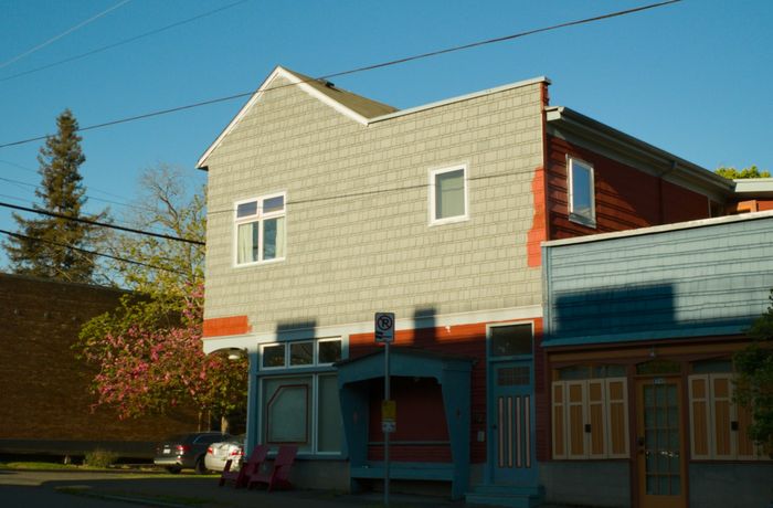 Mix of classic Craftsman homes and modern townhomes on a Ballard residential street